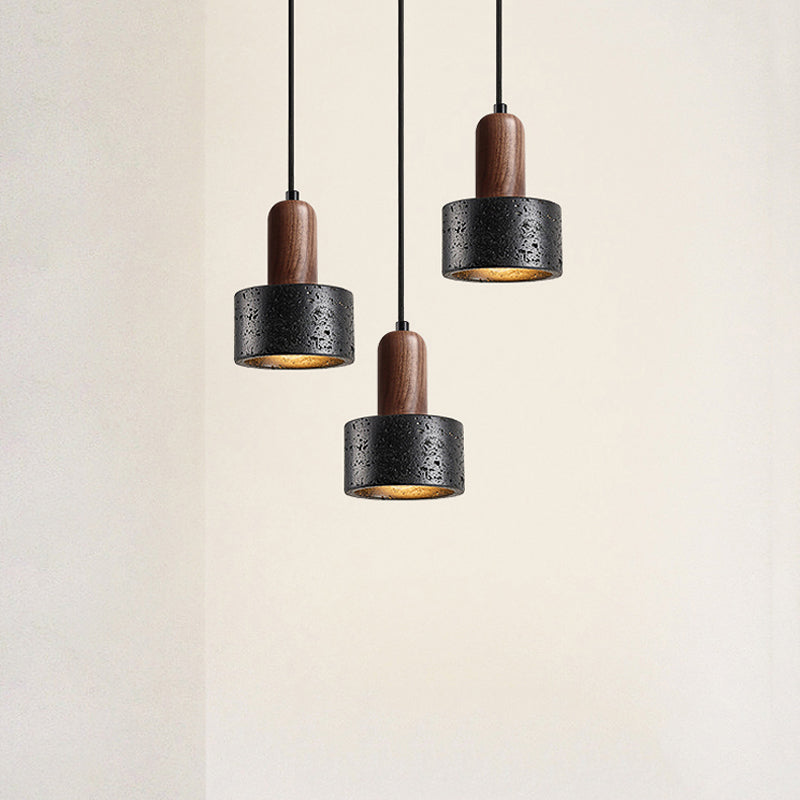 Three pendant lights with wooden accents on a beige background