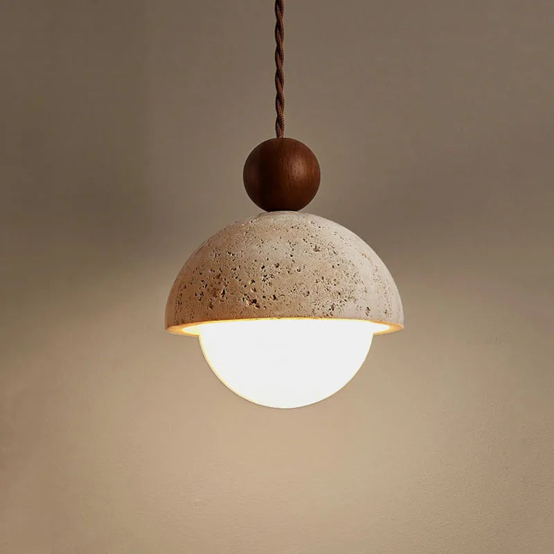 Cement pendant light with brown cord on a beige background