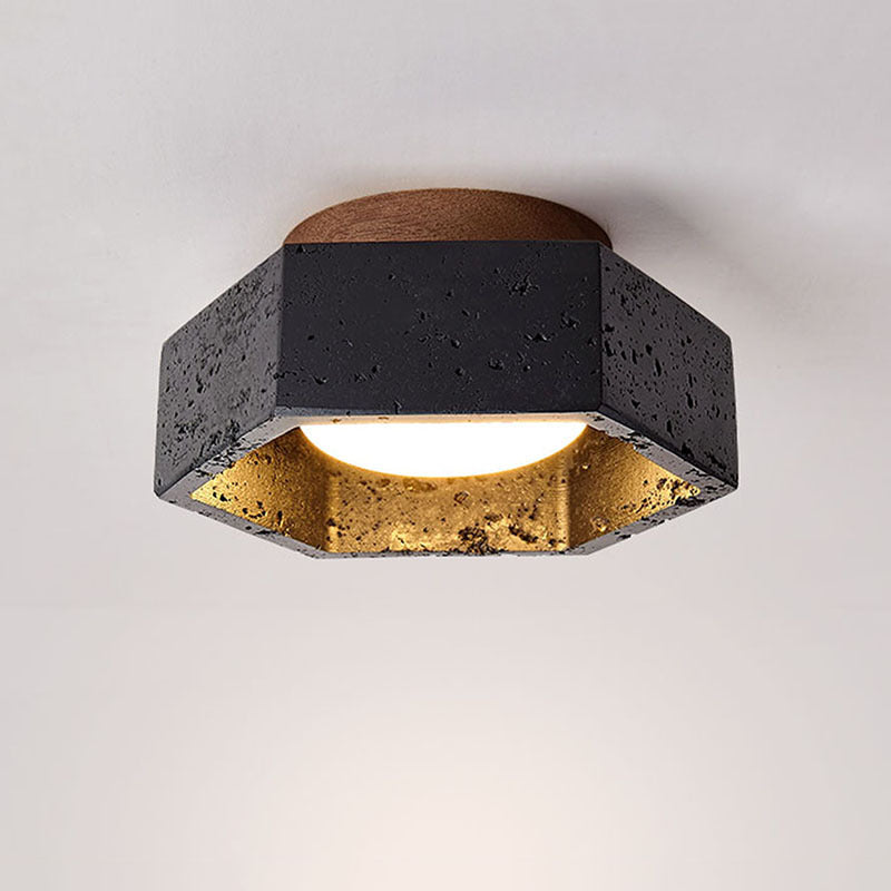 Modern ceiling light fixture with black and gold design on a white background