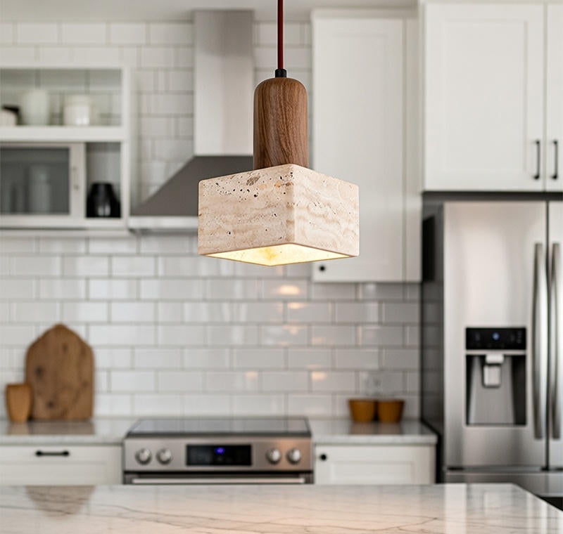 Modern kitchen with a pendant light fixture, stainless steel appliances, and white cabinets.