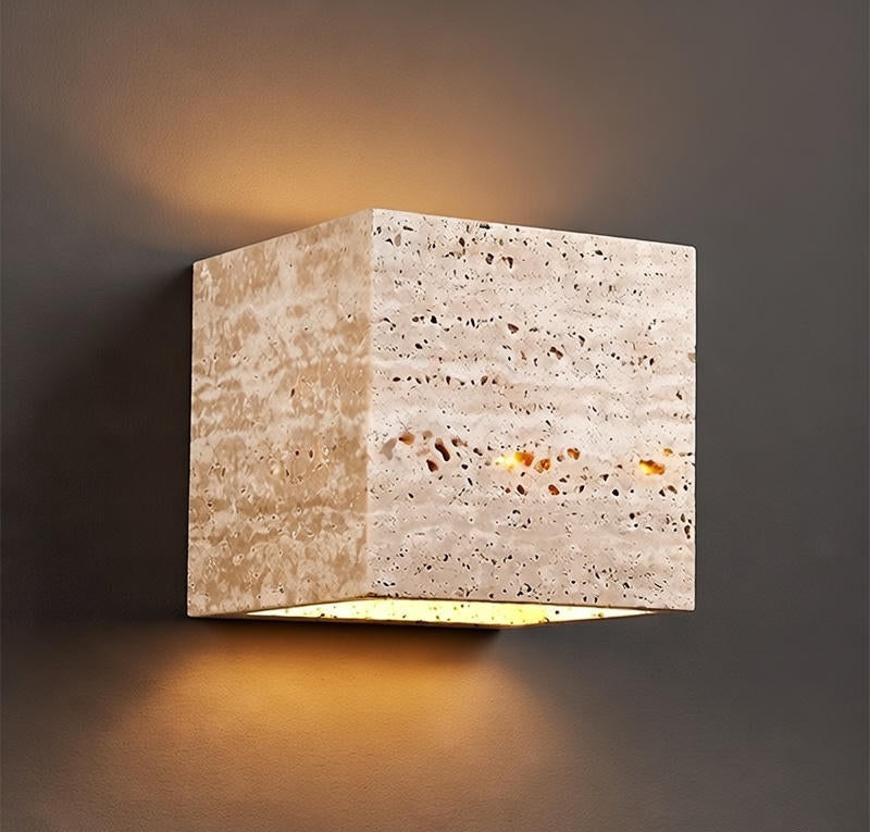 Square concrete wall light fixture on a dark background