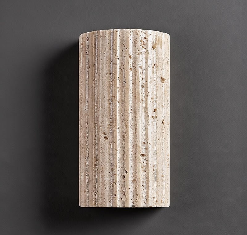 Rectangular stone block with textured surface on a dark background